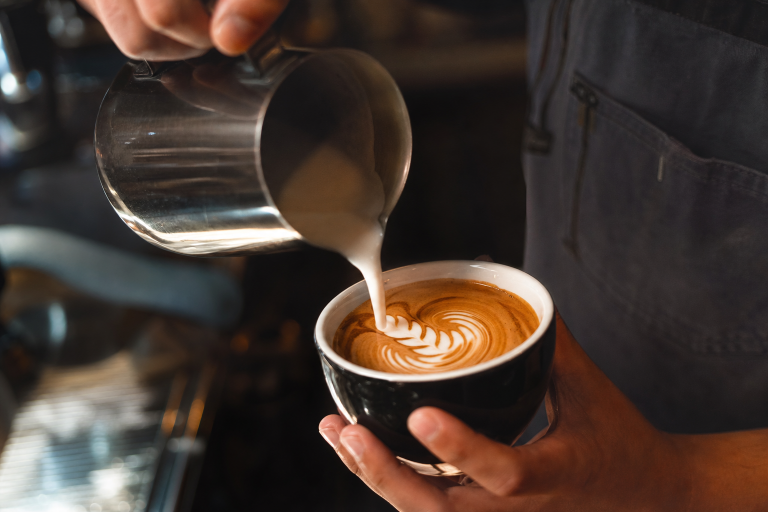 Hands pouring coffee